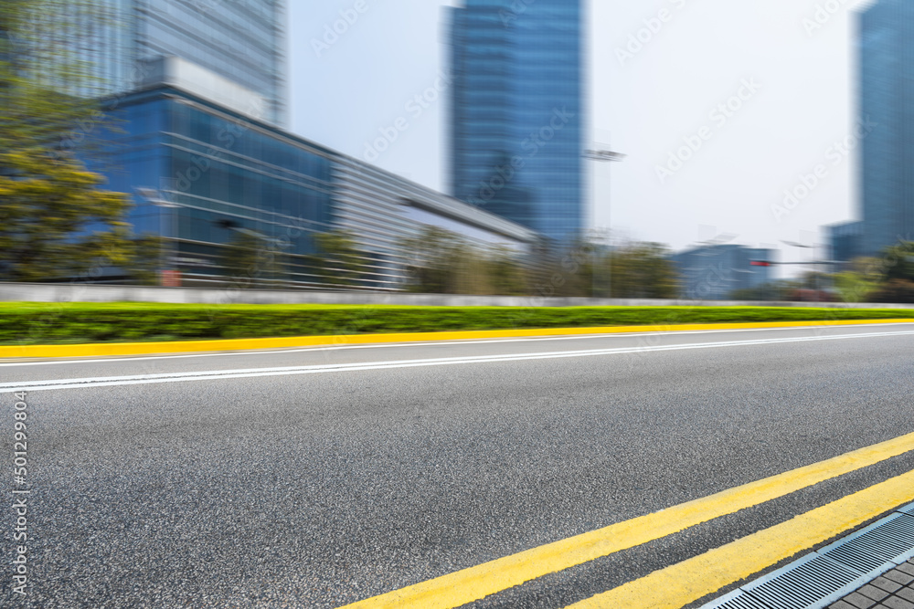 empty road with modern buildings on background, shanghai, china..