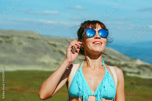 beautiful girl in a swimsuit in the mountains