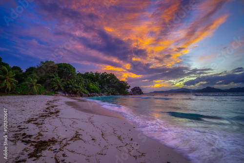 Colorful sunset over Anse Severe Beach at the La Digue Island, Seychelles photo