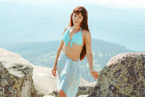 beautiful girl in a swimsuit in the mountains