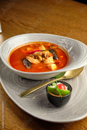Mediterranean cuisine. Mussel soup with tomatoes and herbs