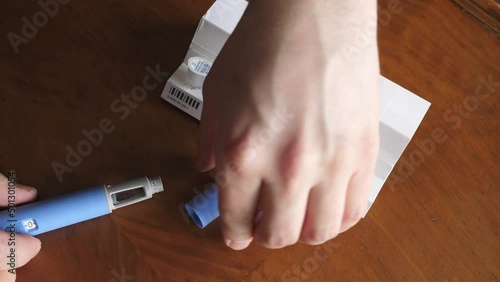 obese fat man preparing Semaglutide Ozempic injection to control blood sugar levels