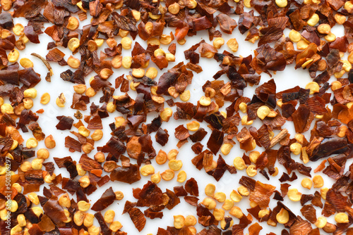 Dried chilli flakes texture background.  Crushed red pepper flakes background.