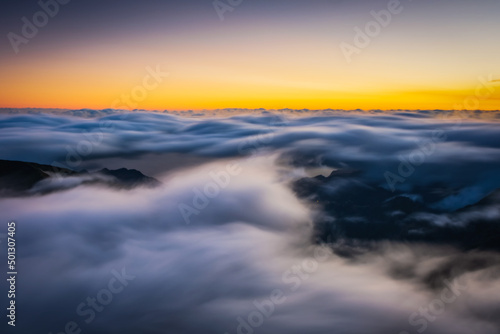 Mountain trail Pico do Arieiro  Madeira Island  Portugal Scenic view of steep and beautiful mountains and clouds during sunrise. October 2021. Long exposure picture