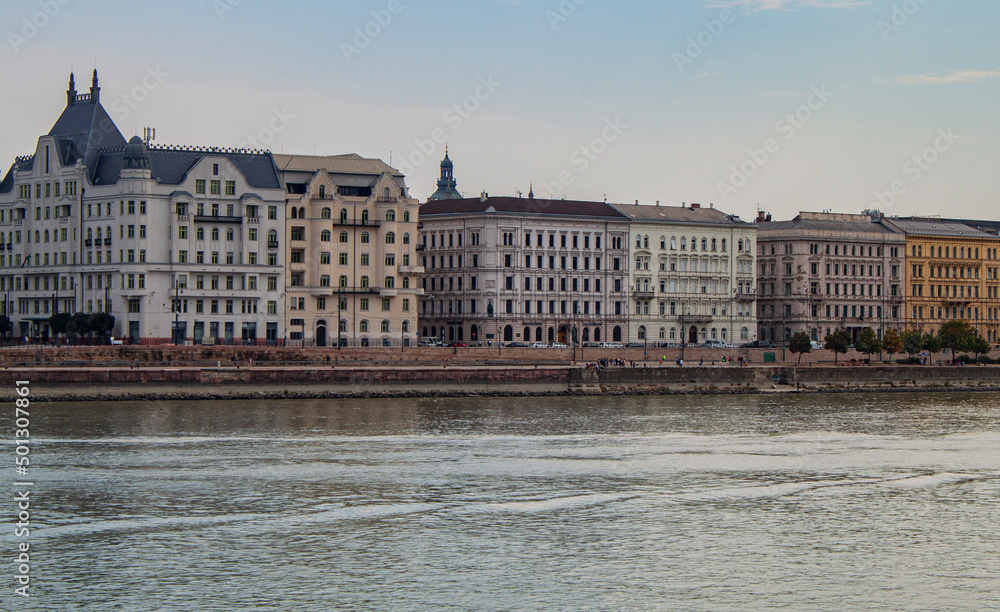 Exterior view of historical old town buildings and River Danube in the downtown of Budapest, Hungary, Europe. Panoramic riverside, European capital city skyline. Colorful houses along the quayside.