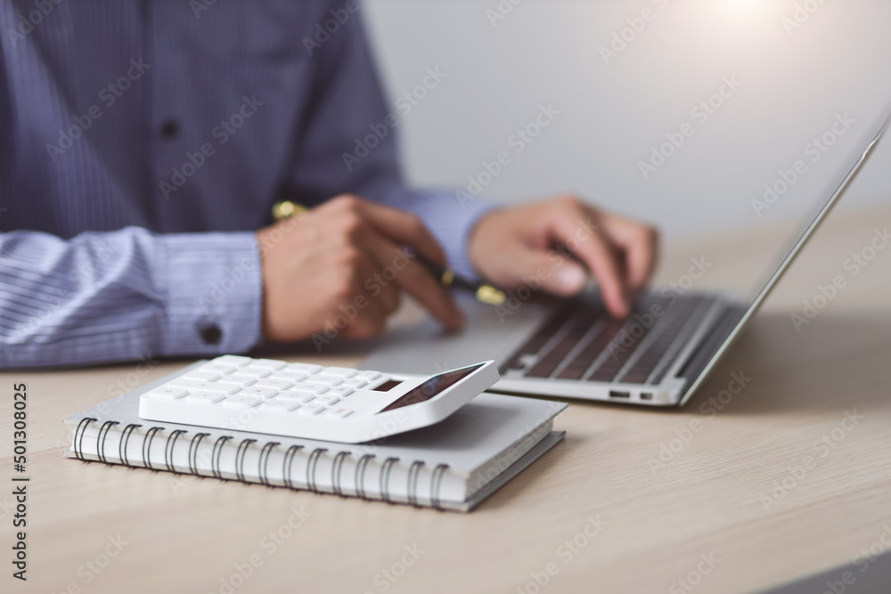 Close up business man working on laptop. Modern Finance and Accounting Concepts Using Accounting Software Close up business man working on laptop. Modern Finance and Accounting Concepts Using Accounting Software