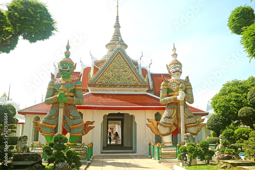 Impressive Eastern Gate of of Wat Arun or The Temple of Dawn Guarding with Two Mythical Giant Demon Sculptures, Bangkok, Thailand