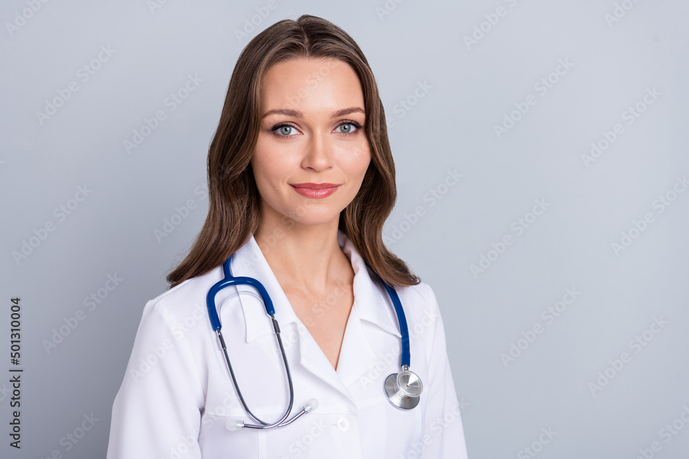 Portrait of experienced assistant lady look hear patient symptoms diagnosis isolated over grey color background Portrait of experienced assistant lady look hear patient symptoms diagnosis isolated over grey color background