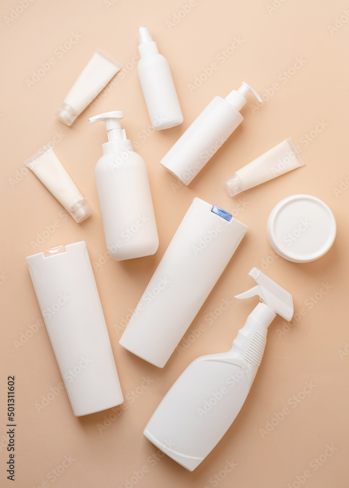 Group of white blank packaging tubes and containers for cosmetics on beige natural color background, mockup design, eco friendly Group of white blank packaging tubes and containers for cosmetics on beige natural color background, mockup design, eco friendly