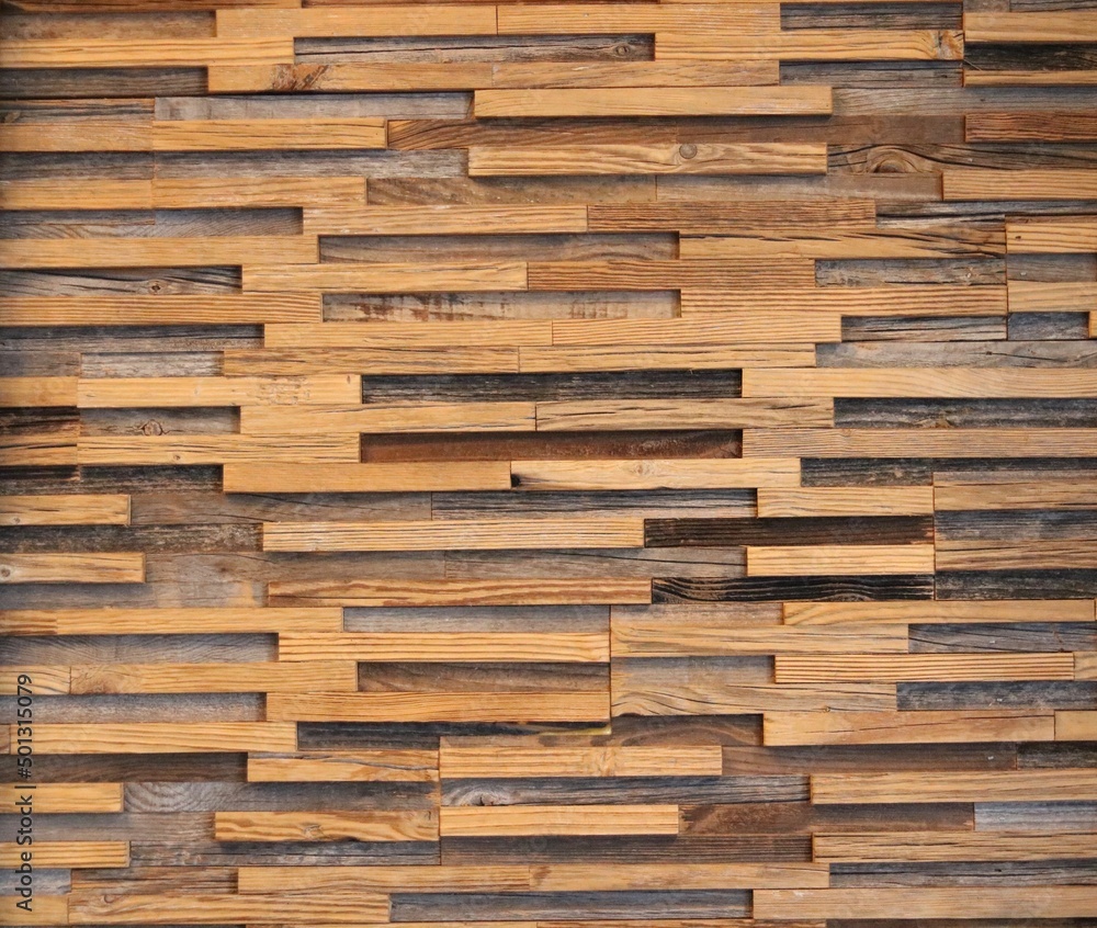 Stained wooden background with grain in assorted colours of brown Stained wooden background with grain in assorted colours of brown