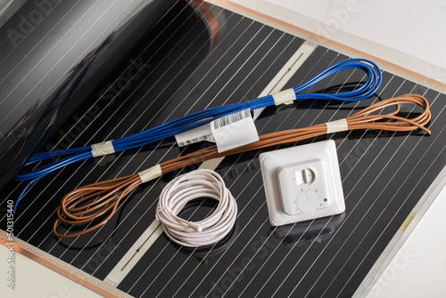 Set for mounting infrared floor heating. Wires, temperature sensor and thermostat. Comfortable, temperature photo