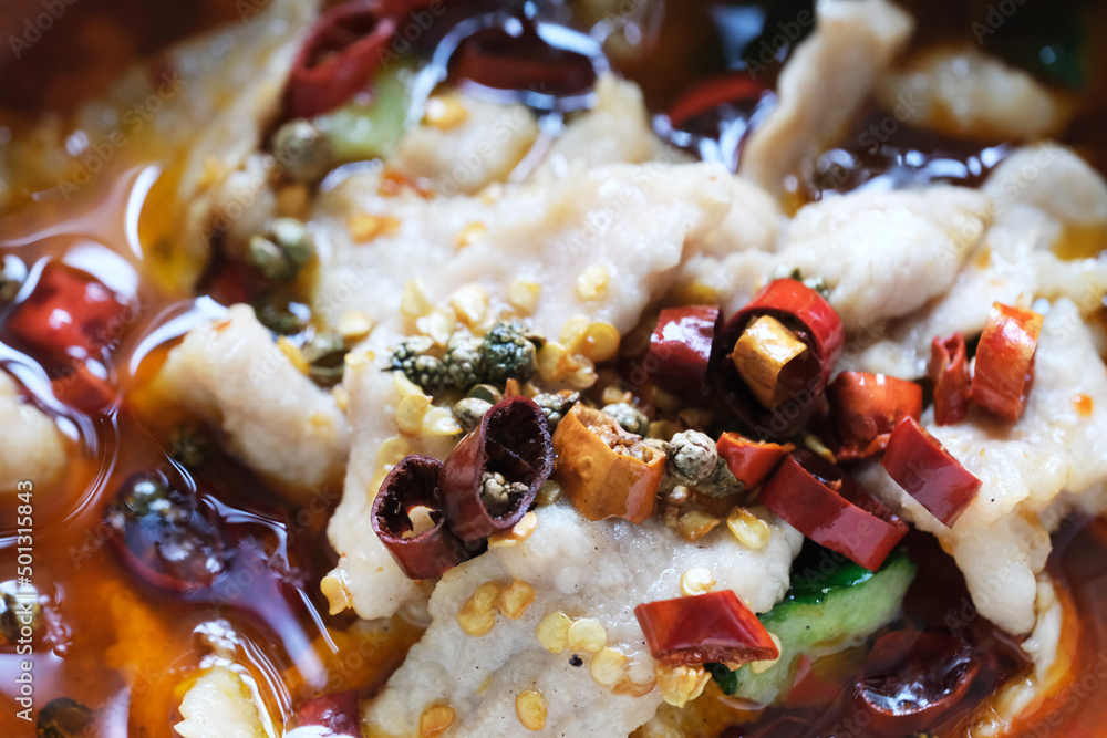 extreme close up spicy Sichuan Boiled pork (Poached sliced pork in hot chili oil). A traditional famous Chinese Sichuan cuisine extreme close up spicy Sichuan Boiled pork (Poached sliced pork in hot chili oil). A traditional famous Chinese Sichuan cuisine