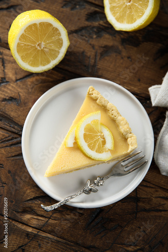 Traditional homemade lemon tart on a white plate