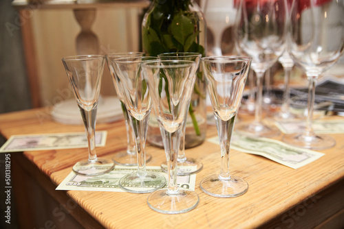 Festive table with delicious appetizers and snacks. Holiday banquet serving with fancy glasses and silverware in restaurant. Wedding birthday party celebration.