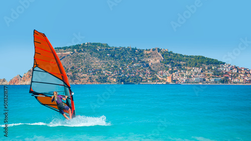 Wallpaper Mural Beautiful blue sky with windsurfer surfing the wind on waves - Alanya, Turkey Torontodigital.ca