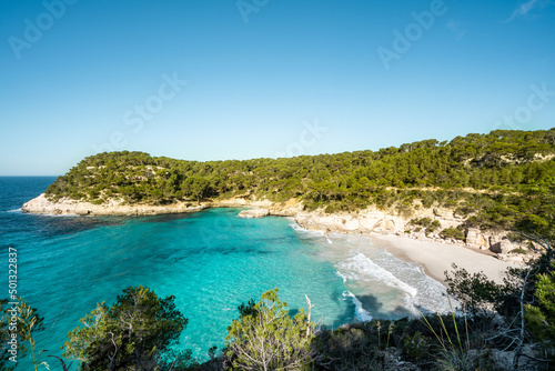 View of Mitjaneta beach with beautiful turquoise sea water, Menorca island, Spain 