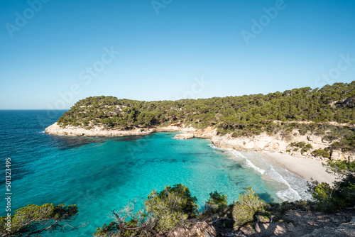 View of Mitjaneta beach with beautiful turquoise sea water  Menorca island  Spain 