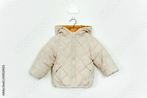 Fotografie Kids warm puffer jacket hanging on a hanger