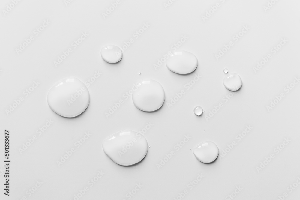 Water drops on white background, top view- Image Water drops on white background, top view- Image