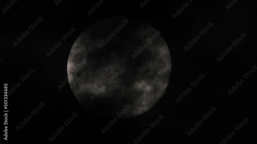 Time Lapse of full moon moves across dark sky, Clouds passing through Time Lapse of full moon moves across dark sky, Clouds passing through