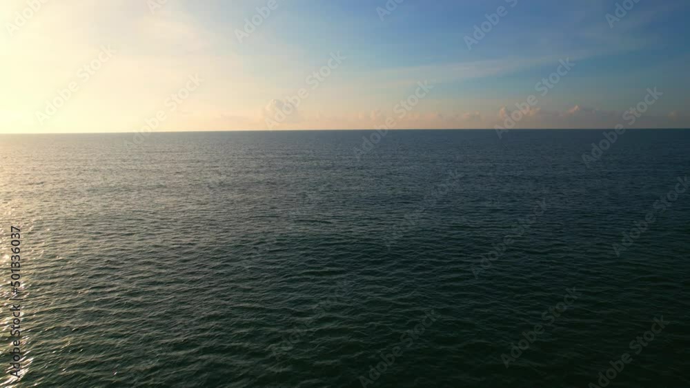 4K Aerial view of drone move on beautiful sea, Flight over ocean. Dynamic aerial shot. Perfect for holiday summer background. Tropical sea in the Gulf of Thailand. Drone 4k shot.
4K Aerial view of drone move on beautiful sea, Flight over ocean. Dynamic aerial shot. Perfect for holiday summer background. Tropical sea in the Gulf of Thailand. Drone 4k shot.