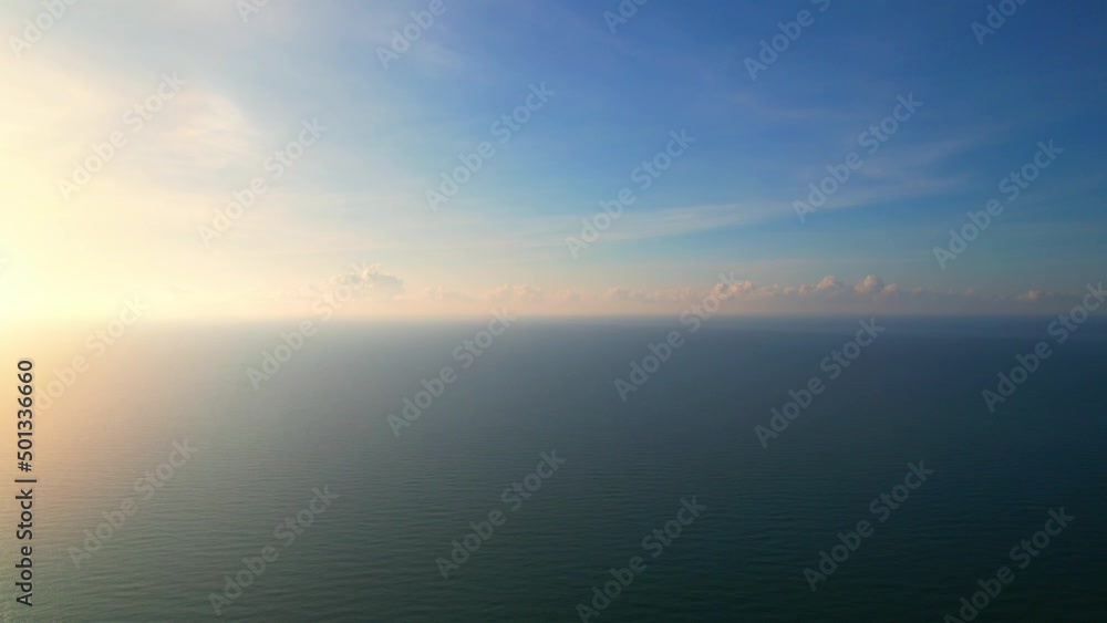 Aerial view from a drone, waves in the orange sea Sunset from the beautiful horizon. 4K
Aerial view from a drone, waves in the orange sea Sunset from the beautiful horizon. 4K