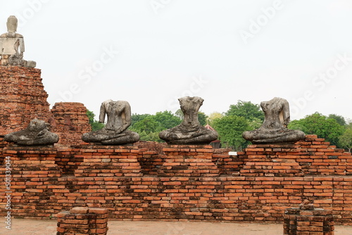 Old temple with buddha statues ruins at Ayutthaya Historical, Thailand photo