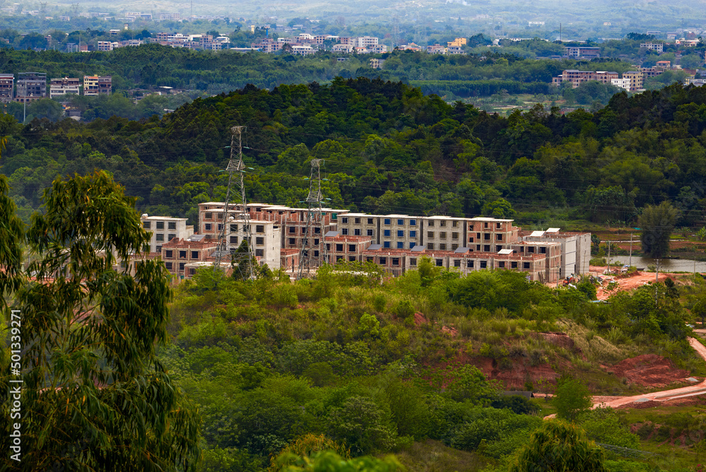 Fototapeta premium Suburban mountain landscape and distant mountains in Nanning, Guangxi, China