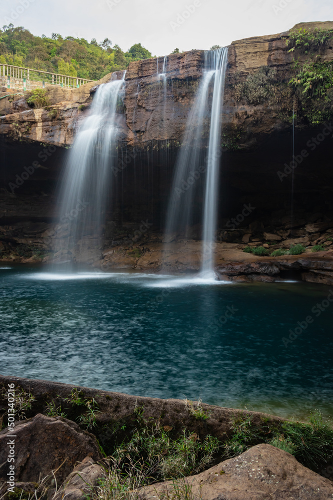 waterfall streams falling from mountain top at morning long exposure shot from different angle waterfall streams falling from mountain top at morning long exposure shot from different angle