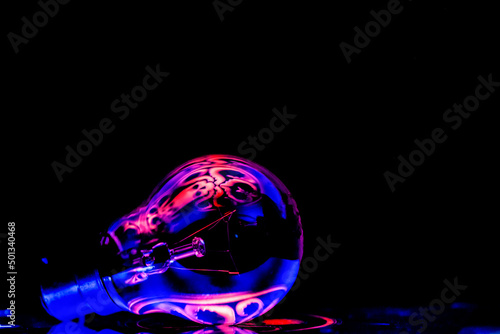 beautiful light effect on a bulb photography on a black background 