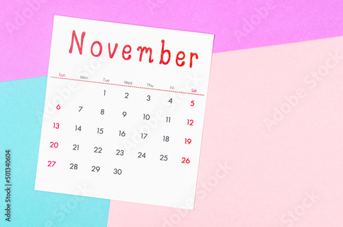 November 2022 calendar on multicolored background.