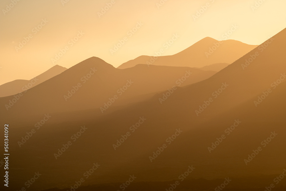Sunset behind volcanos of the timanfaya national park on Lanzarote Sunset behind volcanos of the timanfaya national park on Lanzarote