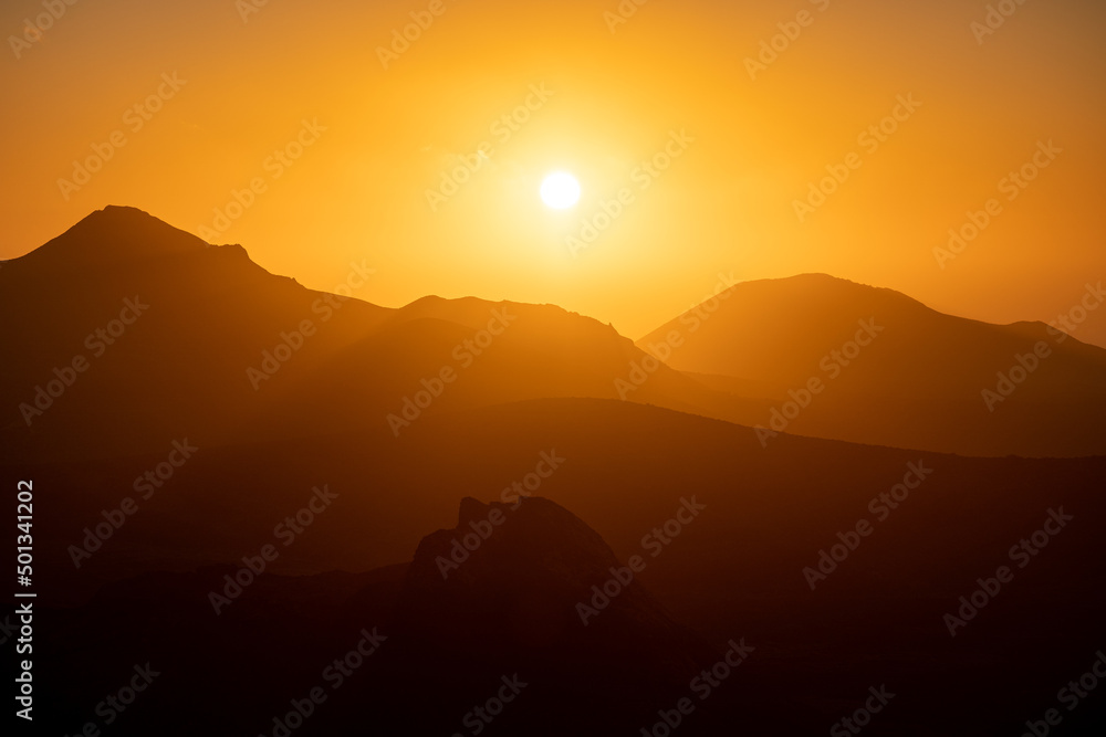 Sunset behind volcanos of the timanfaya national park on Lanzarote Sunset behind volcanos of the timanfaya national park on Lanzarote
