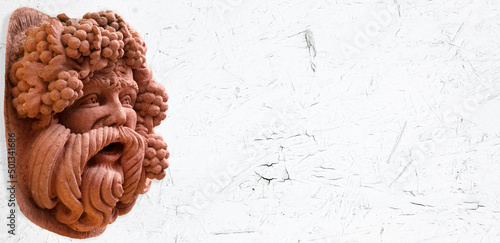 Papier peint Close up of a Bacchus figure on white background with place for text