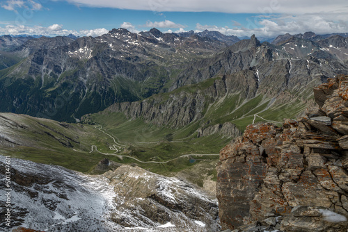 Lacets du Col Agnel , Massif du Queyras en été sous la neige , Hautes-Alpes , France photo