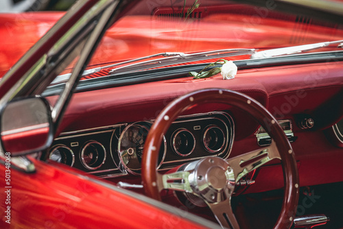 Interior of a red retro car in the parking lot close up