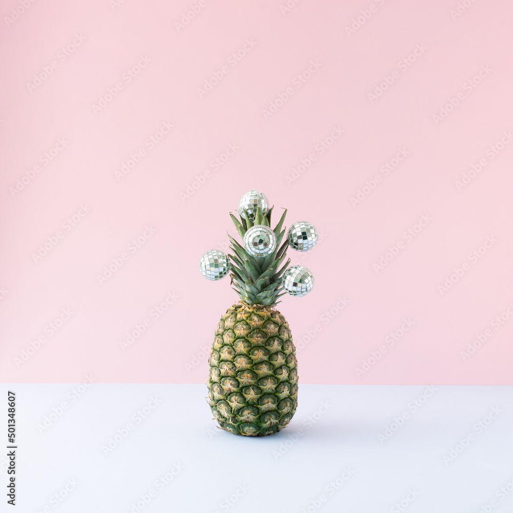 Summer party background - Fresh pineapple with disco balls on pastel background. - obrazy, fototapety, plakaty 
