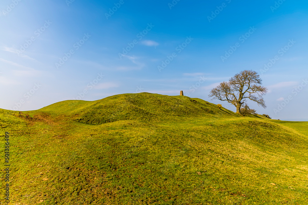 A view towards the eastern ramparts of the Iron Age Hill fort remains at Burrough Hill in Leicestershire, UK in early spring