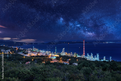 Petrochemical refinery in the night with stars sky. Rijeka. View from Kostrena.