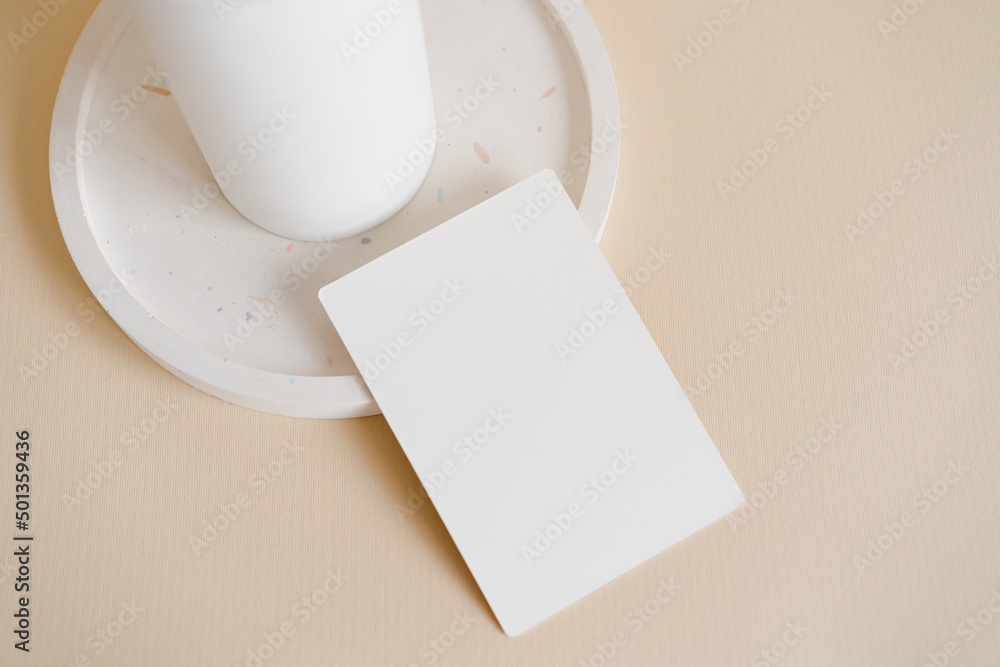 Minimalist menu mock up card on the terrazzo plate on beige background. Vertical modern business card template Minimalist menu mock up card on the terrazzo plate on beige background. Vertical modern business card template