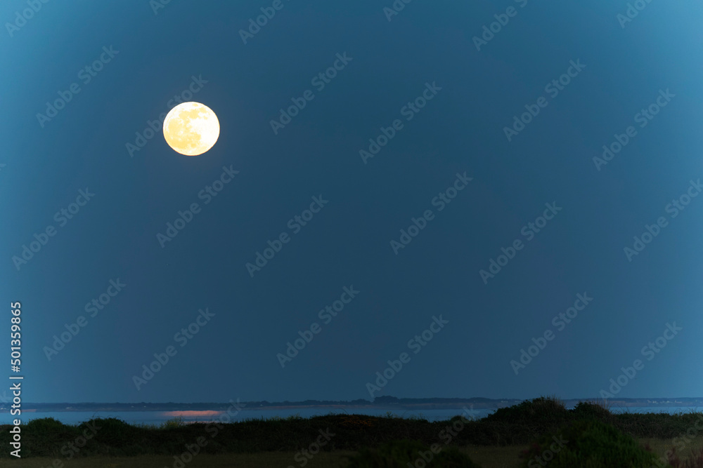 Sunset or moon-rise on the seaside in Morbihan, Bretagne, France Sunset or moon-rise on the seaside in Morbihan, Bretagne, France