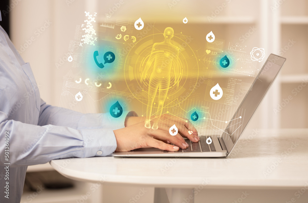 Doctor working on laptop with healthcare concept Doctor working on laptop with healthcare concept