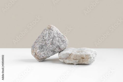 Stone Podium for promotion on beige Background. Natural pedestal. Two stone podiums . Beauty product mockup. Scene to show products. Showcase, display case. Front View, soft shadow