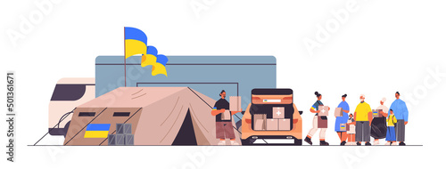volunteers giving help boxes with Ukraininan flag to refugee humanitarian aid material assistance governmental help