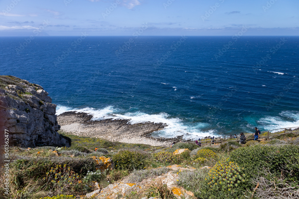 hikers walk towards Cala Genovese on the island of Levanzo. (Egadi) Aegadian Islands, Trapani, Sicily, Italy