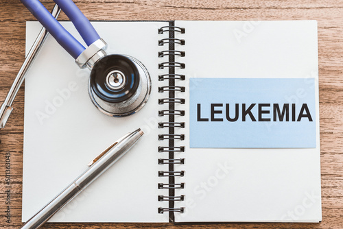 with text LEUKEMIA on notepad on table pen, stethoscope photo