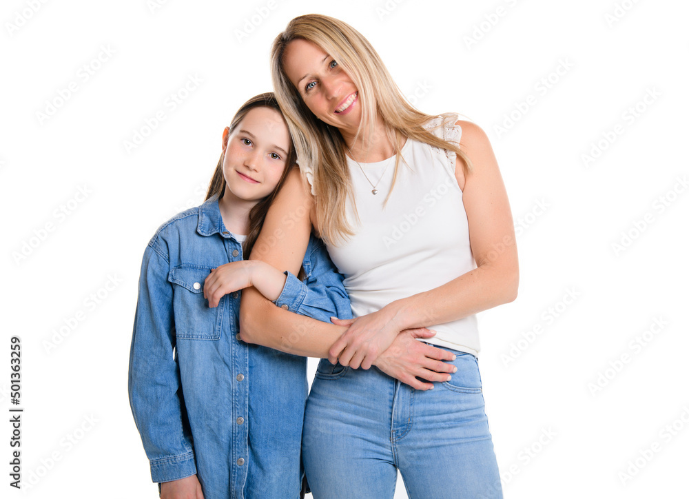 Beautiful pre teen girl with mother on studio white background Beautiful pre teen girl with mother on studio white background