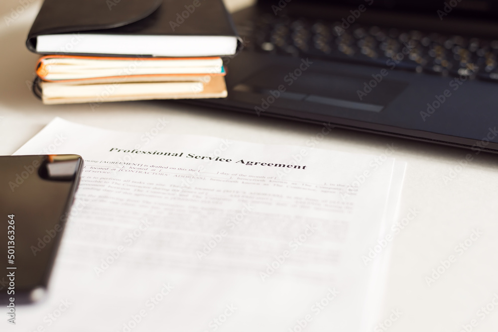Obraz premium Financial documents - notebooks, smartphone, laptop, documents in the office. Business, science, long hours of work.