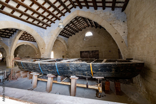 Favignana, (Egadi) Aegadian Islands, Trapani, Sicily, Italy - march 15 2022: ancient wooden boats used for fishing in famous Florio tuna factory or tonnara at Favignana island.