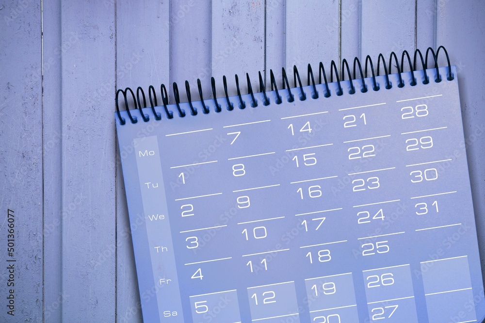 Desktop calendar against paper, 2022. Time and business concept Desktop calendar against paper, 2022. Time and business concept